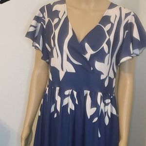 Beautiful maxi dress with knee length slit on left side. Navy Blue/cream color